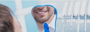 man looking at dental worki